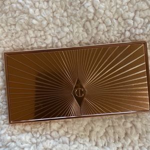Filmstar bronze and glow by Charlotte Tilbury. Medium- Deep